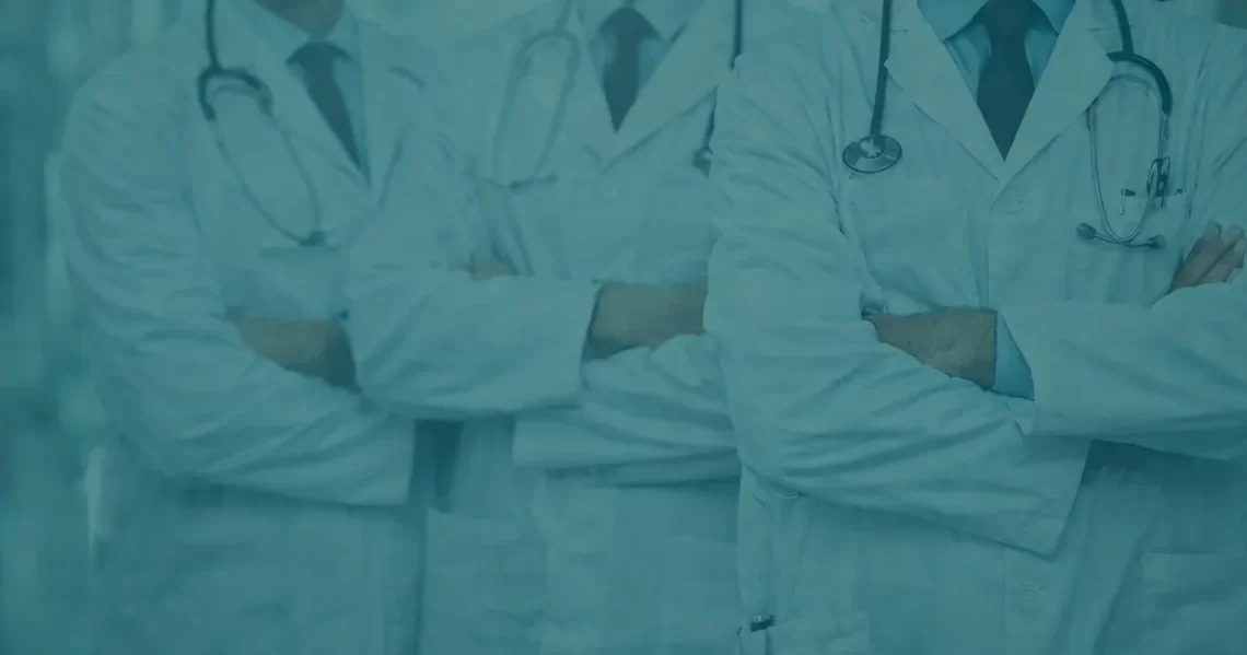 Doctors in lab coats standing together, representing institutional authority and the question of whether experts can always be trusted