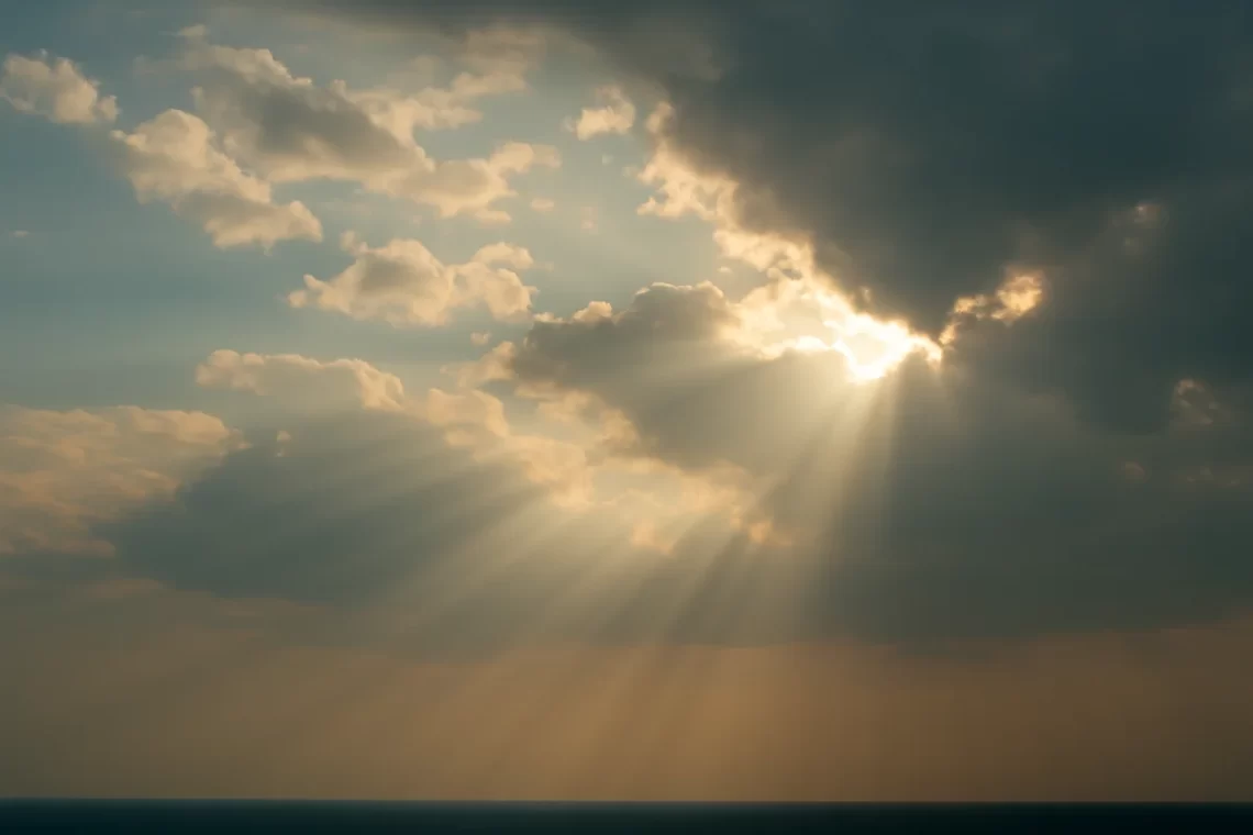 Sunbeams breaking through clouds, symbolizing God’s light returning to a society that has drifted from Him