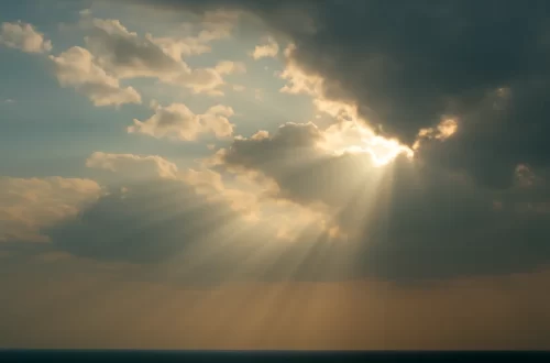 Sunbeams breaking through clouds, symbolizing God’s light returning to a society that has drifted from Him