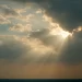 Sunbeams breaking through clouds, symbolizing God’s light returning to a society that has drifted from Him