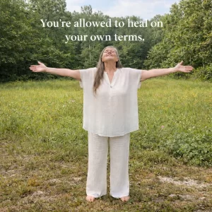 Donna Appel standing barefoot in a meadow with arms open, reflecting personal healing, choice, and health sovereignty