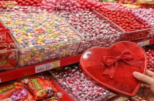 Valentine’s Day candy display showing brightly colored sweets and packaged chocolates, representing chemicals used in the modern food system.