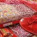 Valentine’s Day candy display showing brightly colored sweets and packaged chocolates, representing chemicals used in the modern food system.